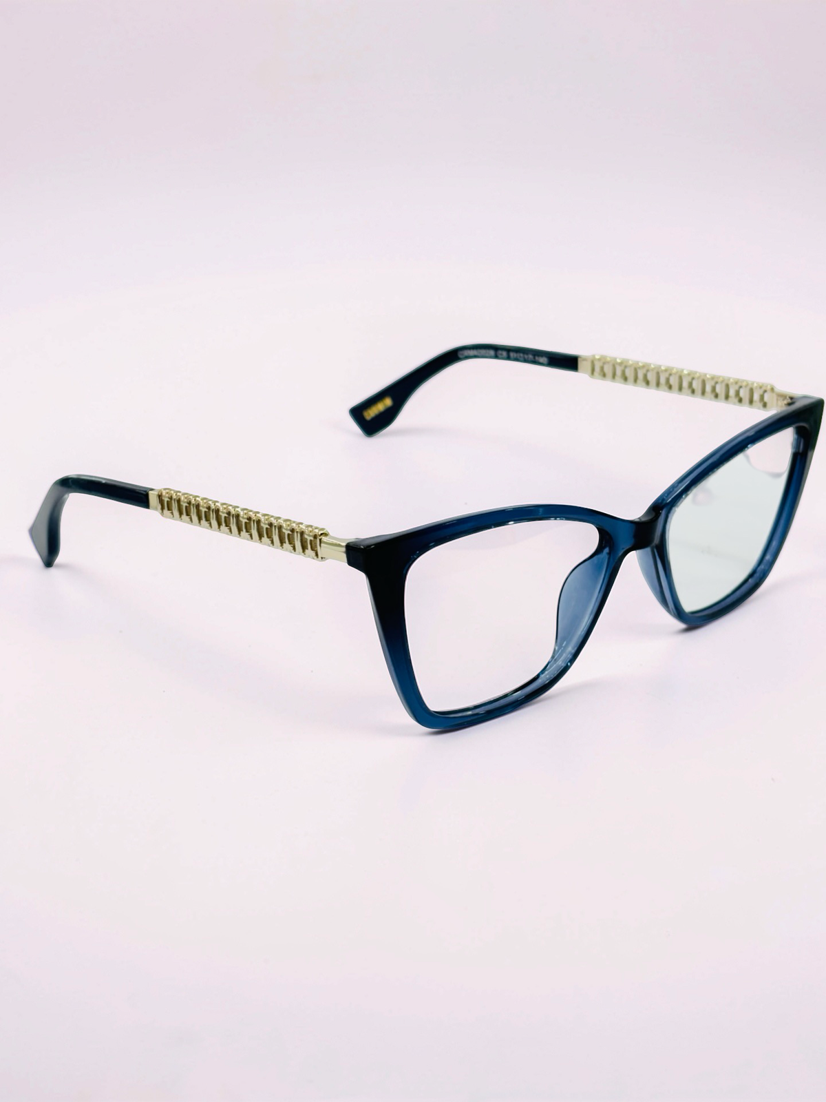 Detachable sun clip in front of blue cat-eye optical frame