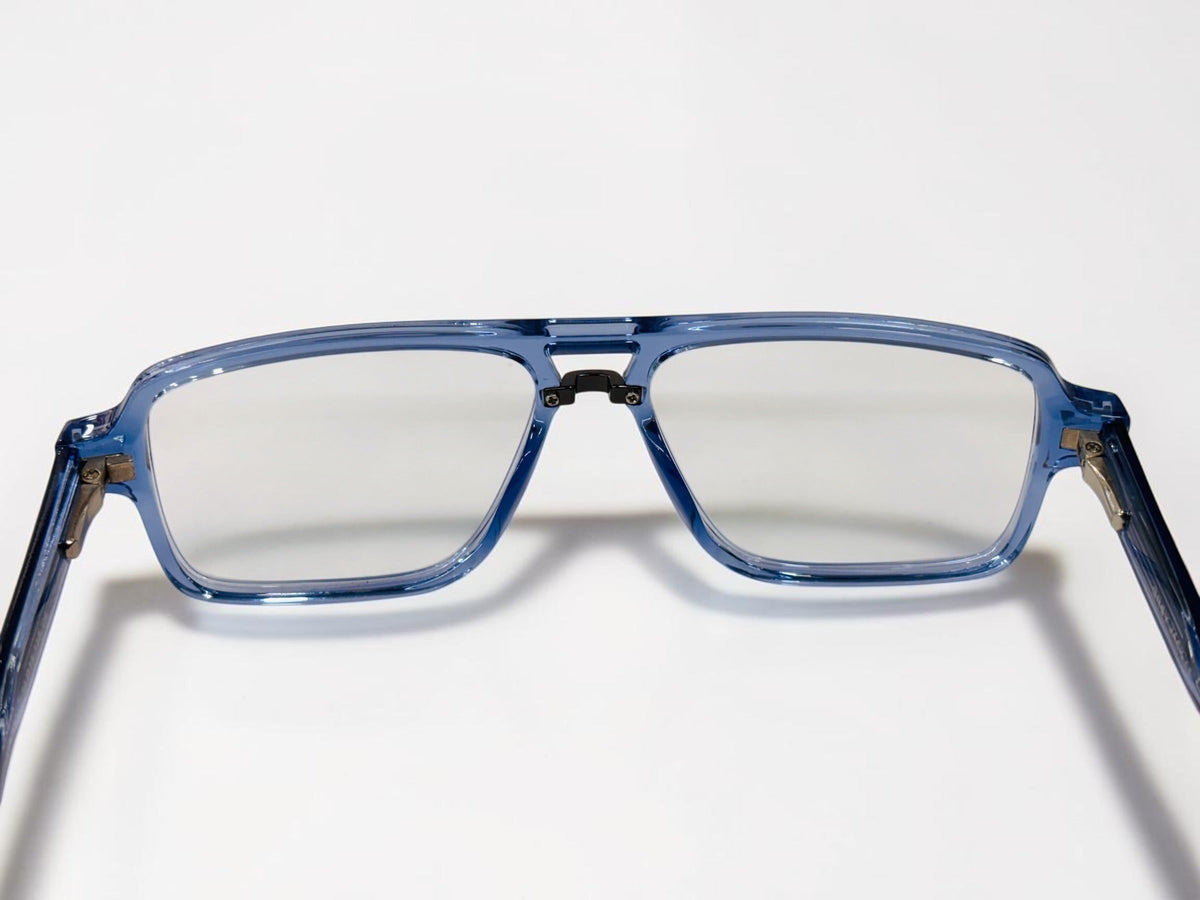 Straight-on view of the blue square-aviator frame with clear lenses