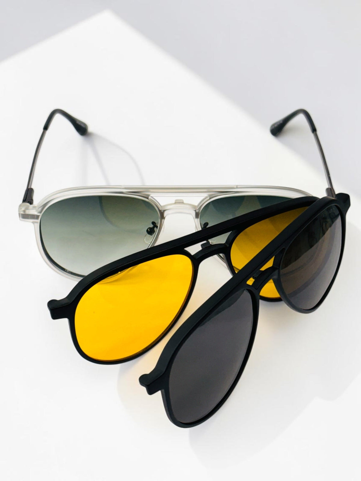 Front view of black metal aviator clip-on frame with clear lenses