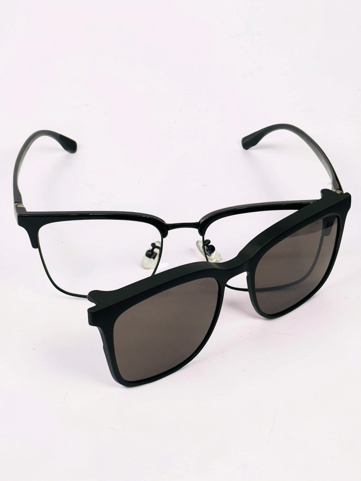 Black frame with matching dark clip-on lens attached