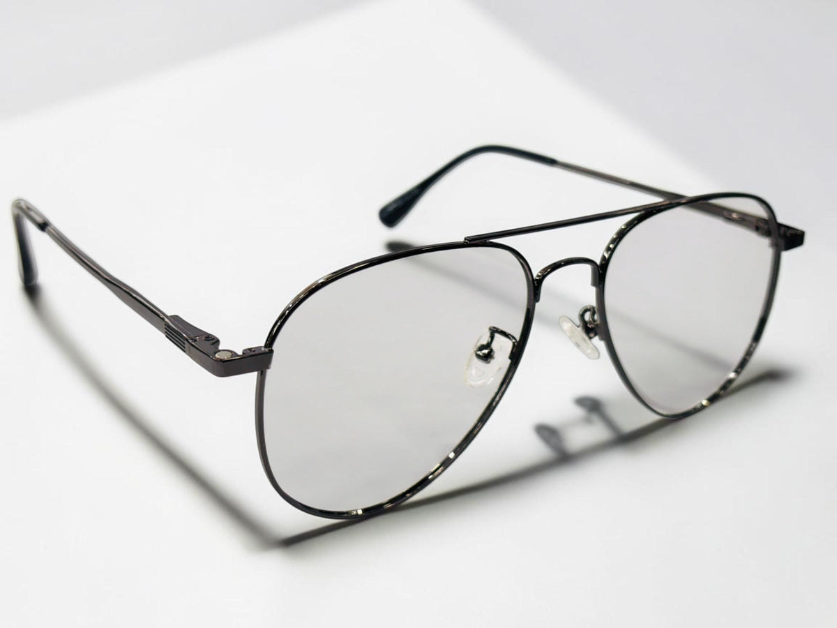 Three interchangeable sunglass clips in different shades alongside the frame