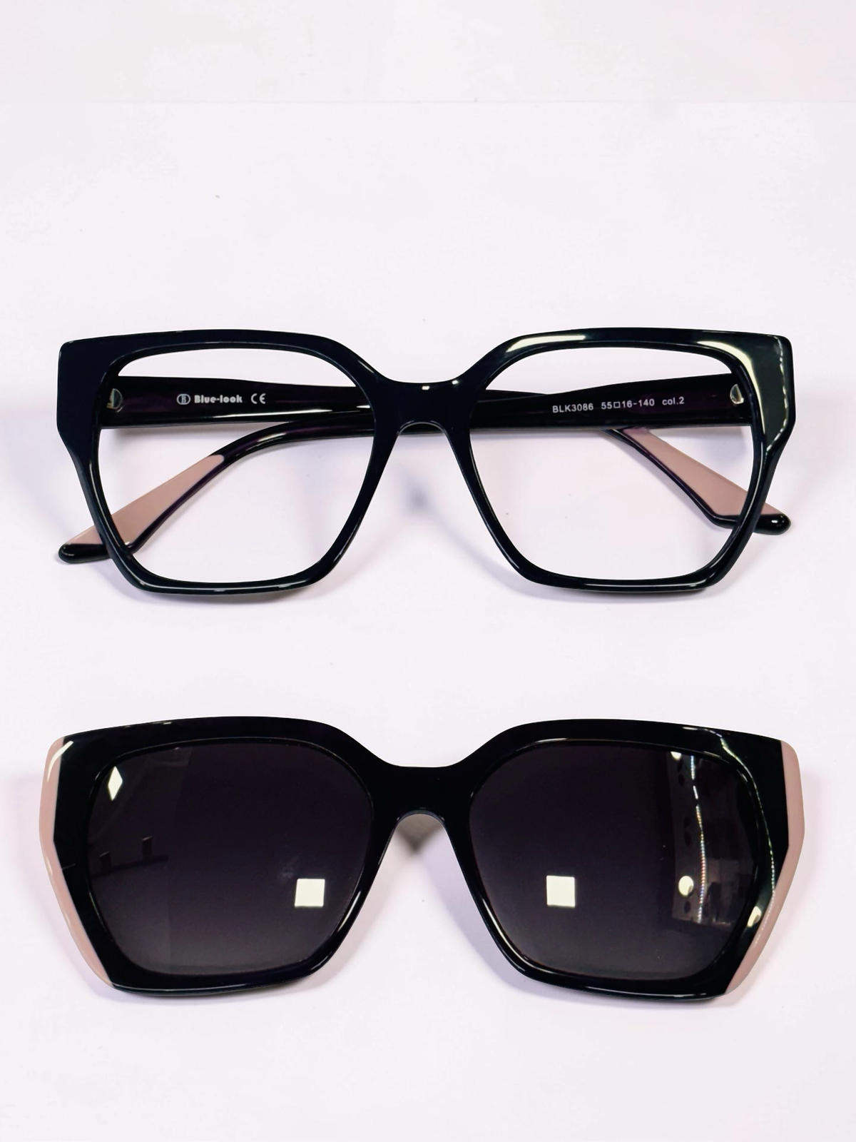 Black cat-eye optical frame with matching dark gradient clip-on