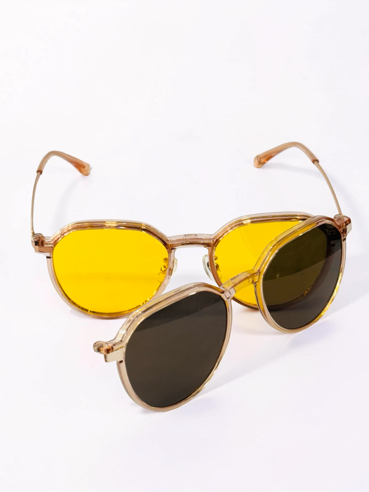 Unisex gold geometric clip-on frame shown from the front with clear lenses