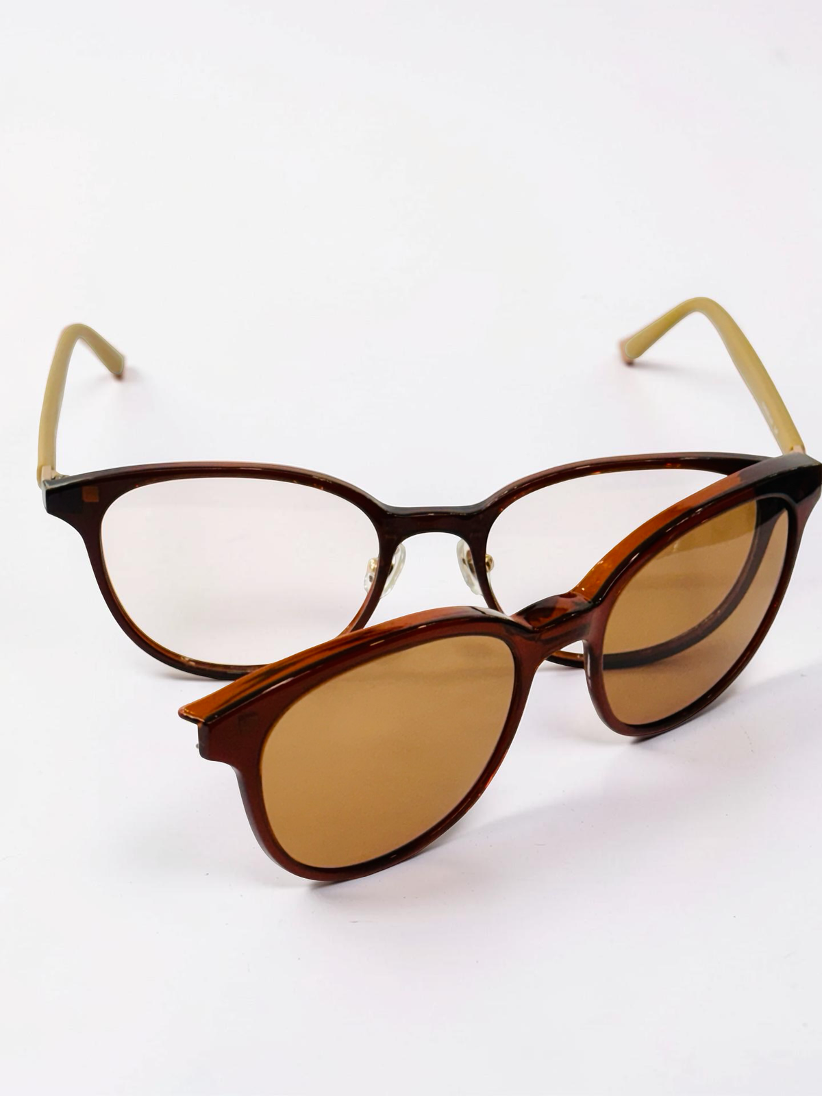Angled view of dark tortoiseshell glasses with yellow-brown temples