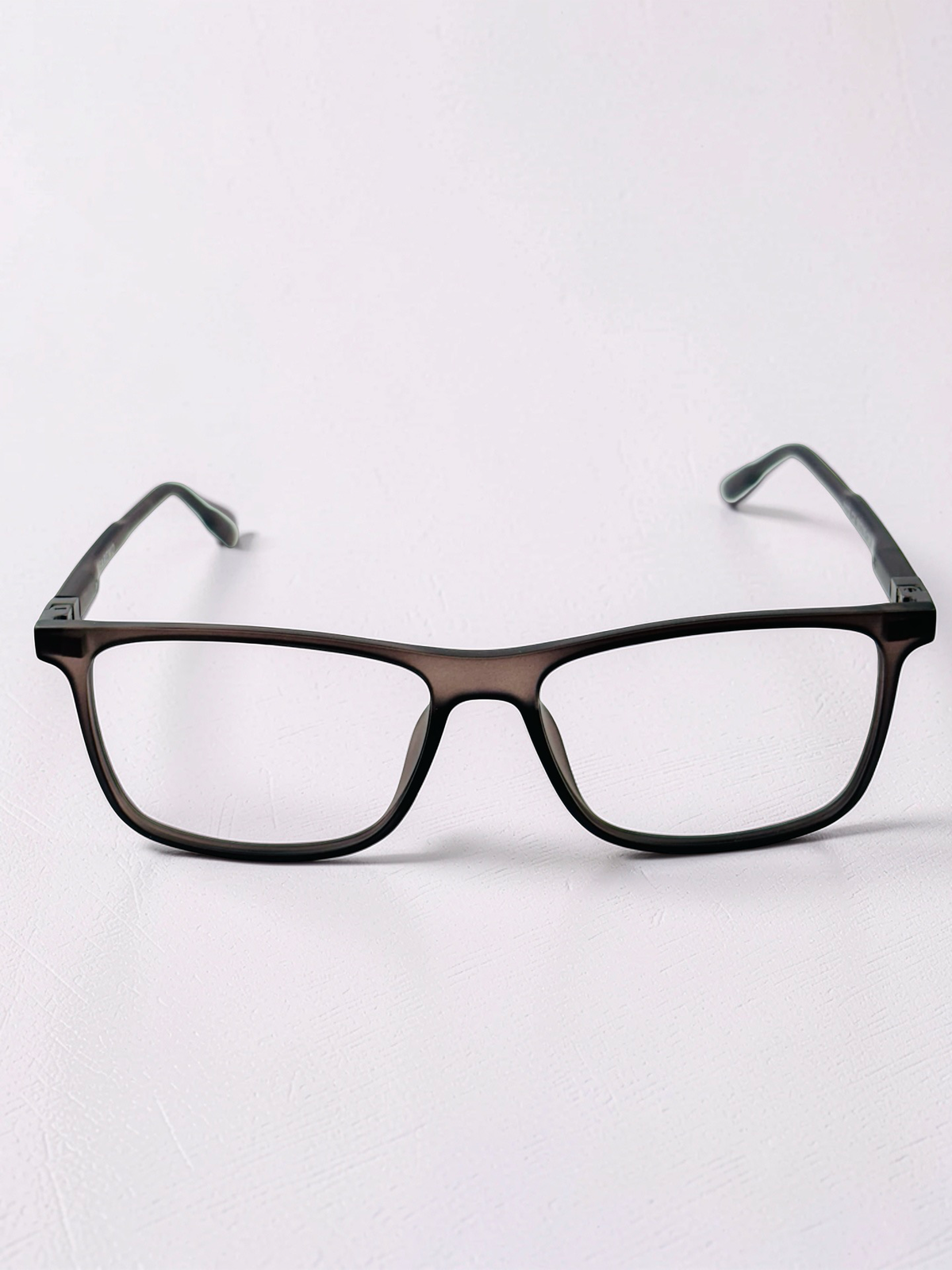Angled view of clear-lens clip-on frame