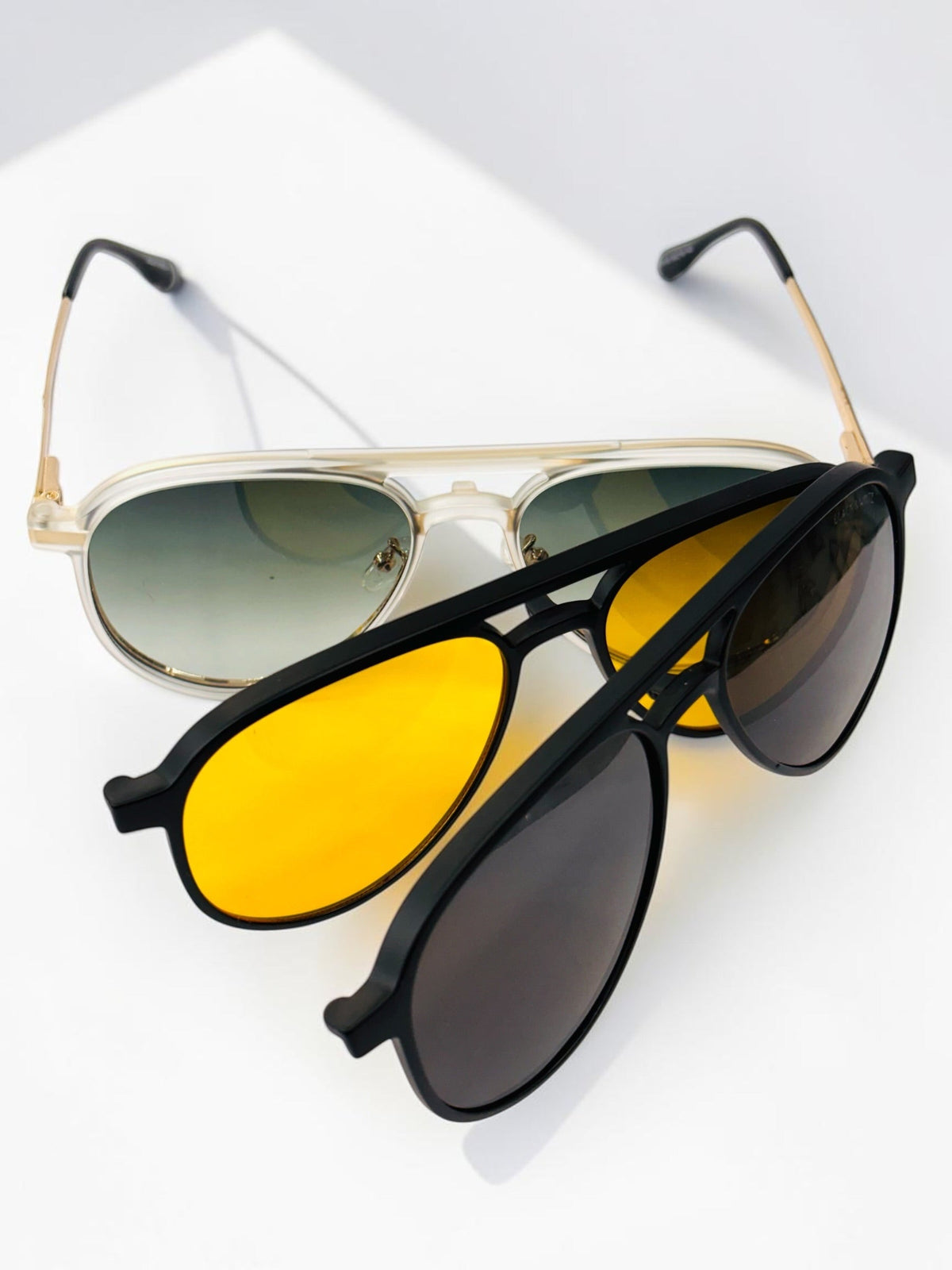 Gold aviator clip-on frame with green gradient clip attached plus yellow and dark sun clips