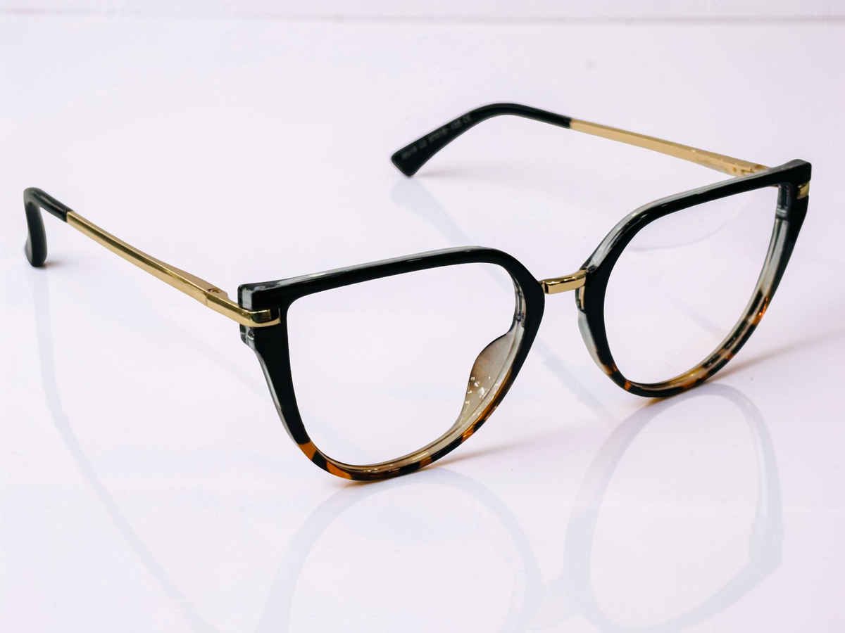Angled rear view of black and tortoiseshell clip-on frame