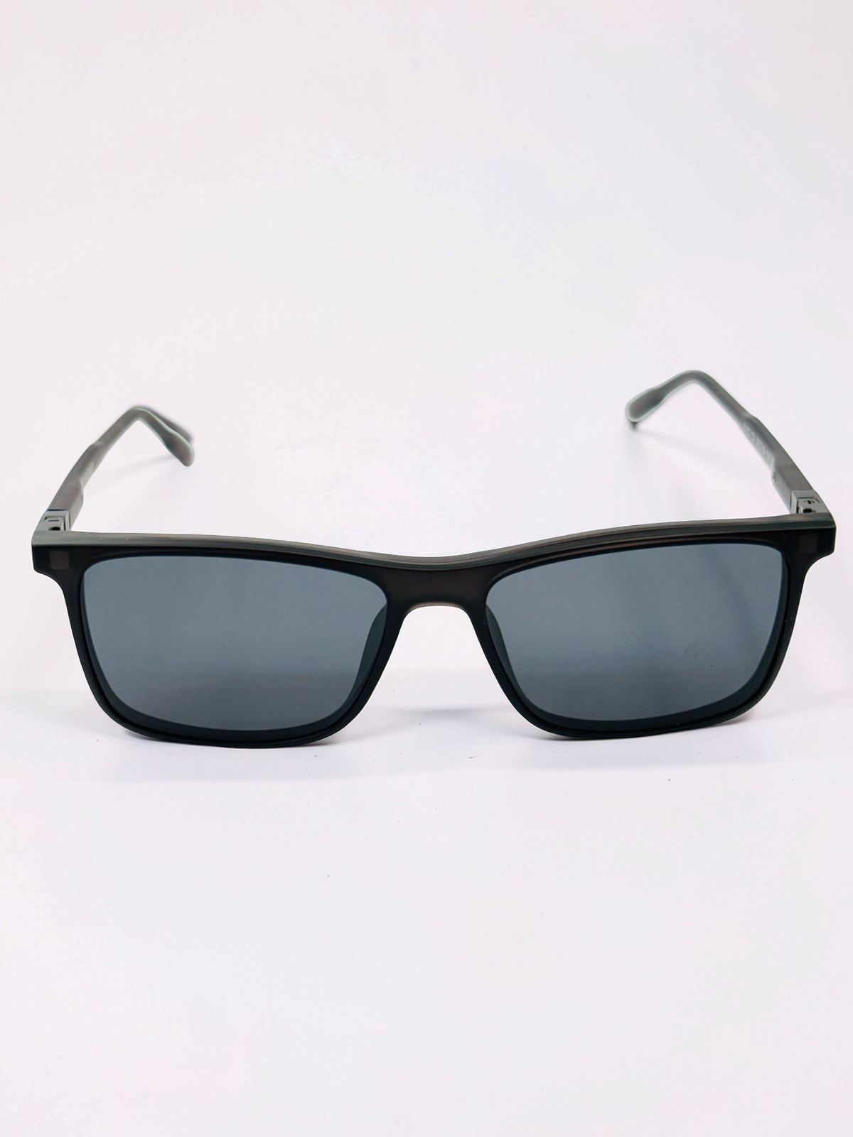 Front view of translucent charcoal rectangular frame with dark polarized clip attached
