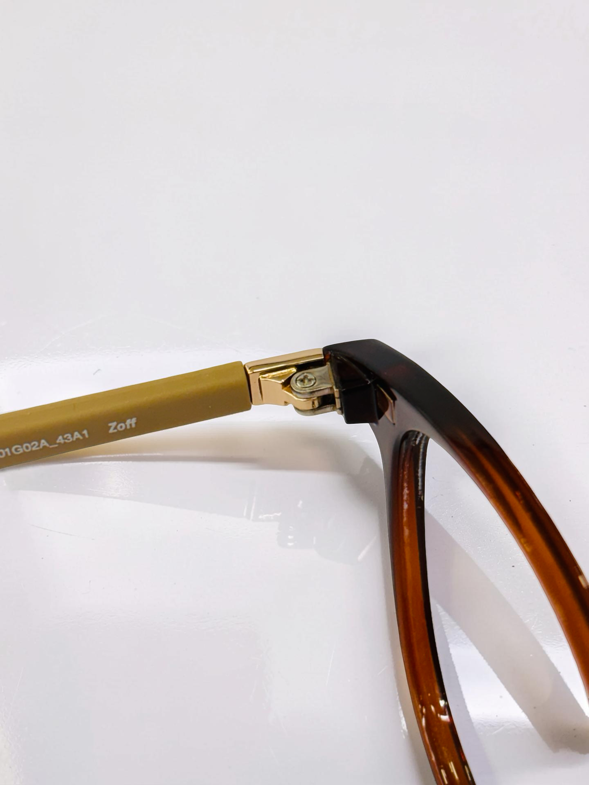 Front view of dark tortoiseshell frame and brown-tinted clip-on
