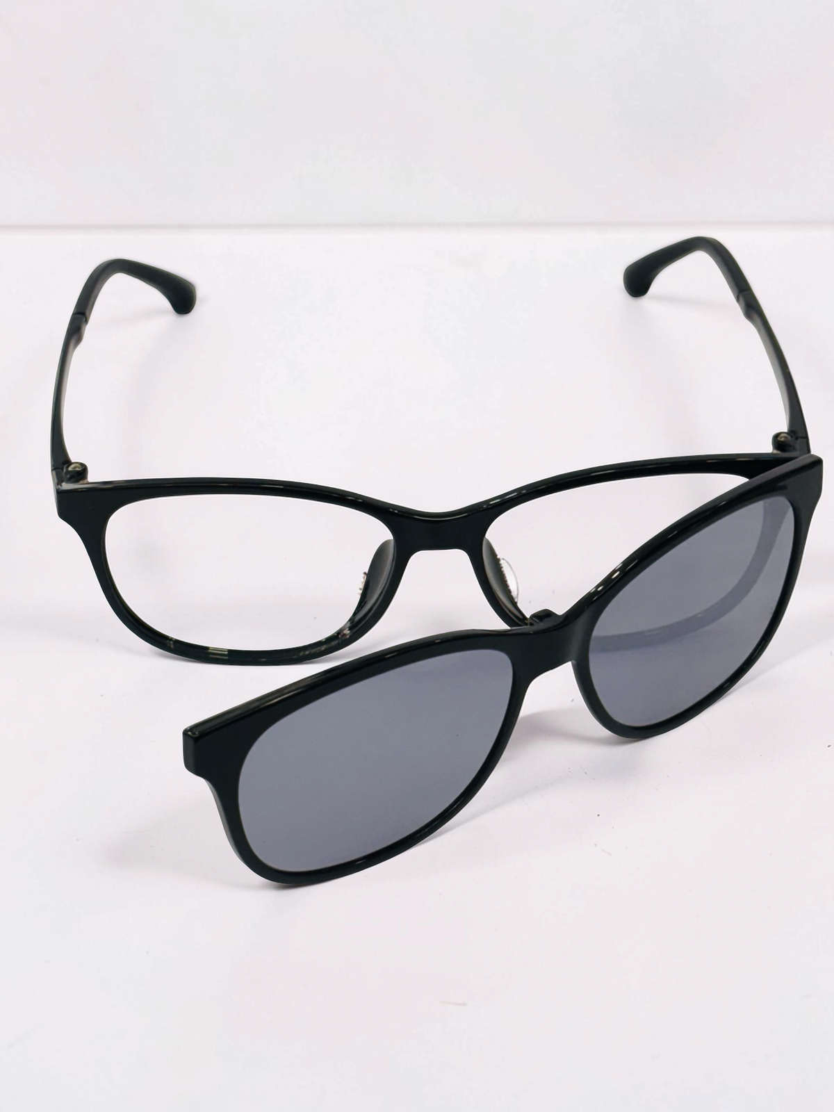 Angled view of the black rectangular optical frame