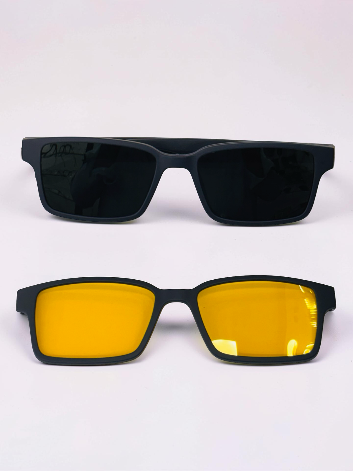 Dark and yellow detachable clip-on lenses shown separately