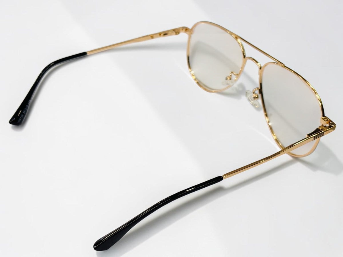 Gold aviator frame shown with detachable dark and yellow clip-on lenses
