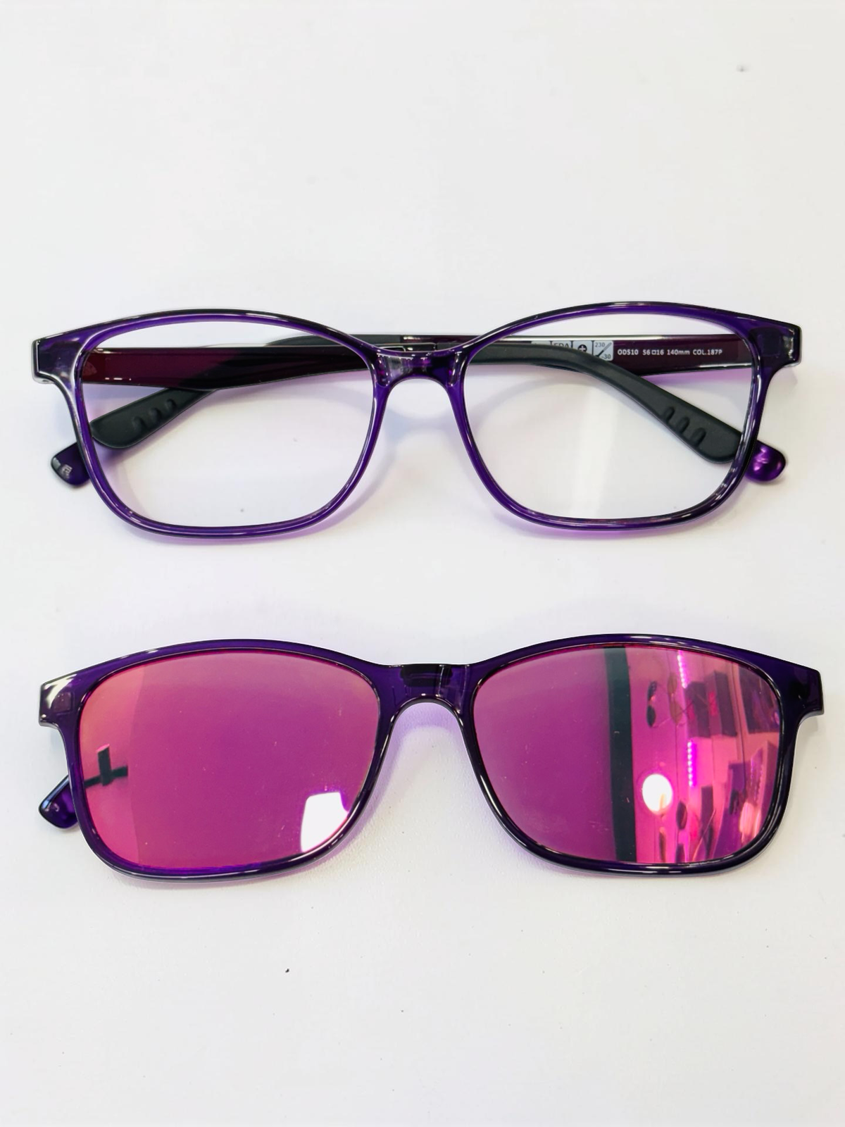 Purple clip-on eyeglasses with detachable pink mirrored sun lenses